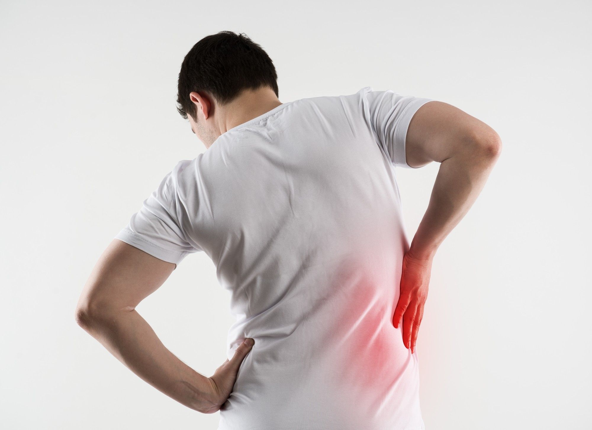 man with hip pain shown in red