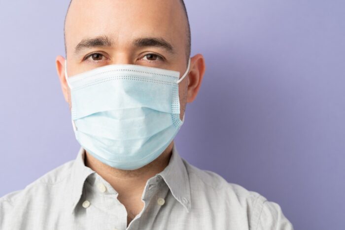 Closeup of a Caucasian man wearing a face mask during the covid19 coronavirus pandemic
