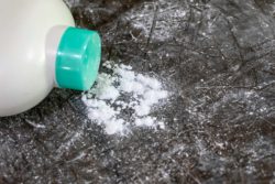 talc powder product spilled on table