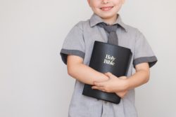 young male child with bible