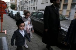 Jewish orthodox family walking home