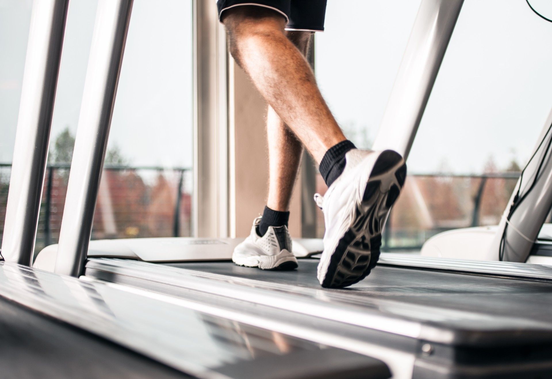 Man's legs running on treadmill