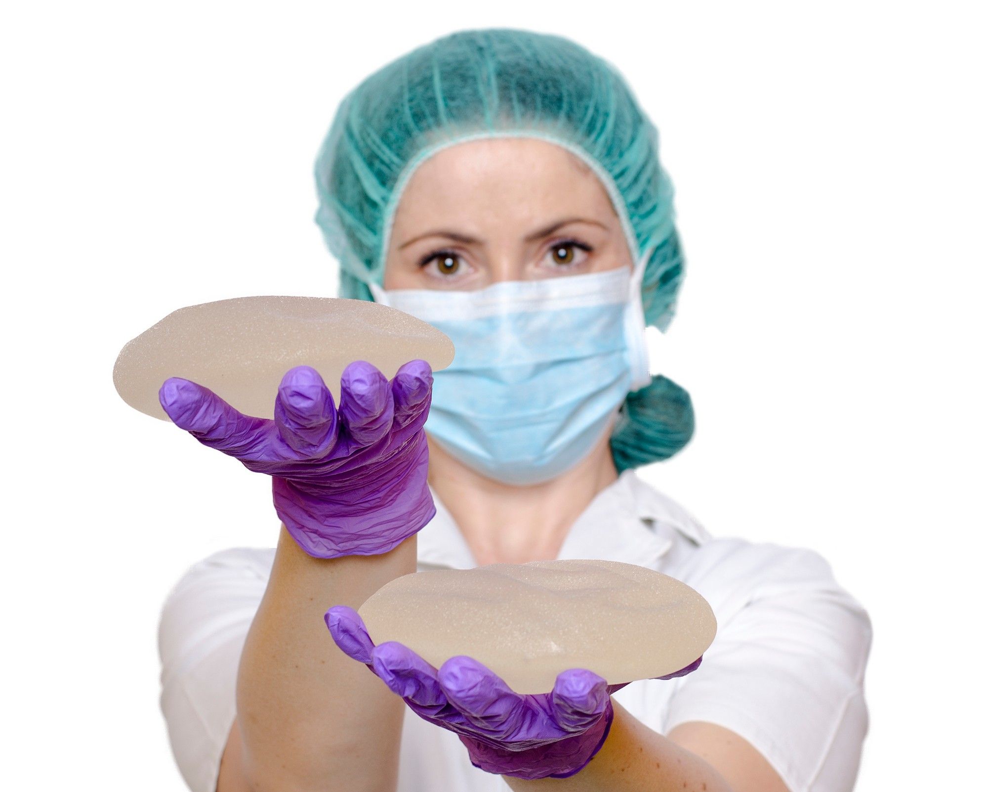 nurse holding breast implants