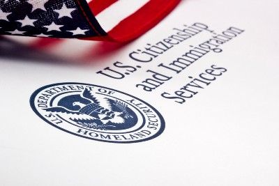 U.S. Citizenship and Immigration Services seal with U.S. flag - Census data
