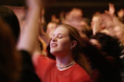 young woman in worship