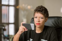 Woman not pleased as she reads text message