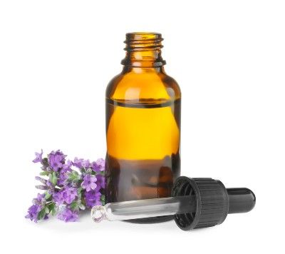 Brown essentail oil bottle with dropper and lavender flowers on white background - Young Living pyramid scheme