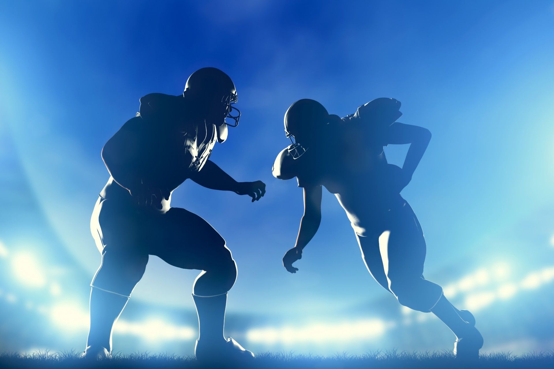 Two football players on the field are backlit with blue light - NFL players