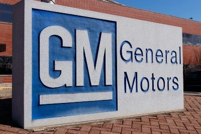 General Motors sign in front of building - GMC Acadia