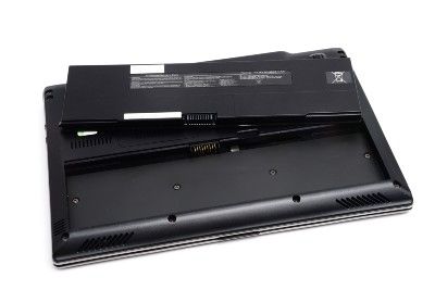 Bottom side of laptop with battery removed and sitting on top - Amazon products