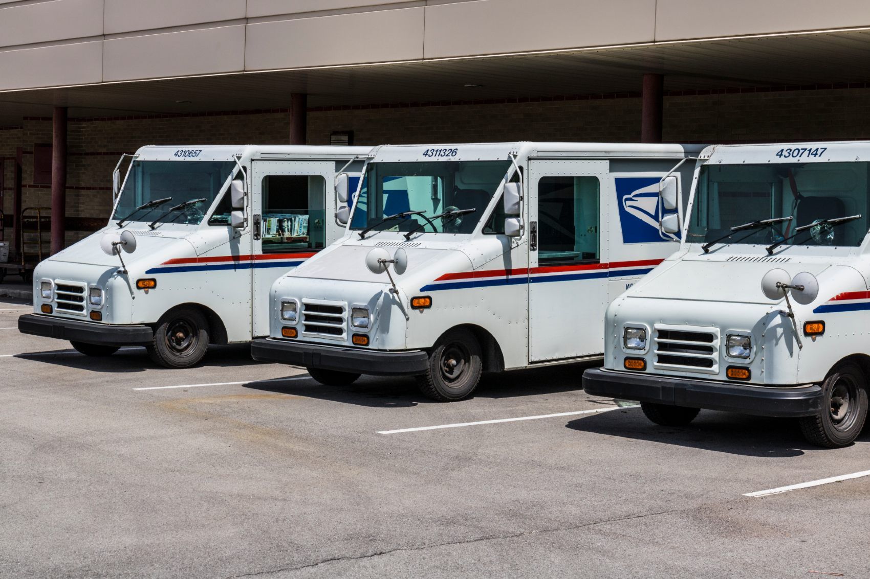 USPS vehicles parked at post office - election