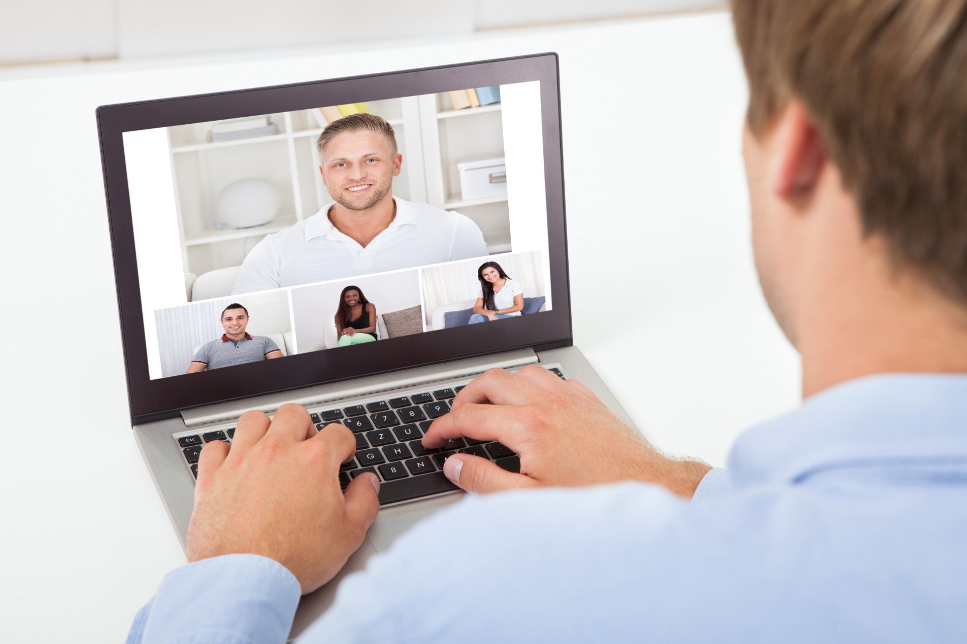Man has a video conference on his laptop with four others - zoom privacy lawsuit