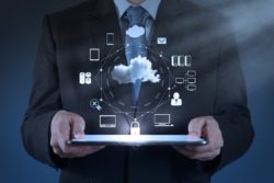Businessman holds cloud computing diagram