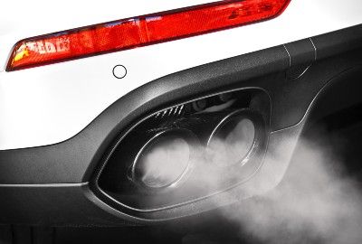 Exhaust comes from white vehicle's exhaust pipe - vehicle emissions