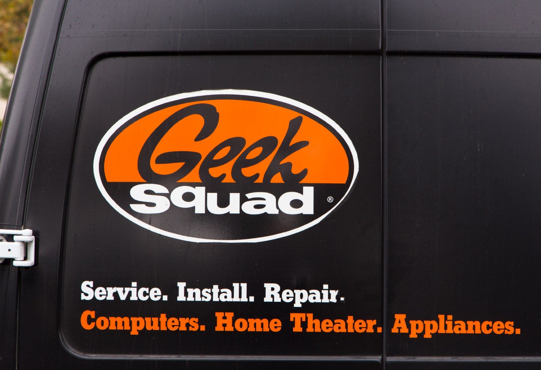 The back door of a black Geek Squad van - home security system installation