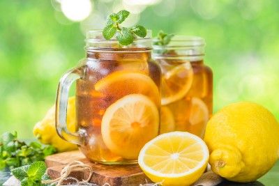 Iced tea in glasses with lemons - arnold palmer drink