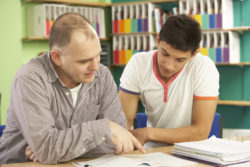 Teenage student with male tutor