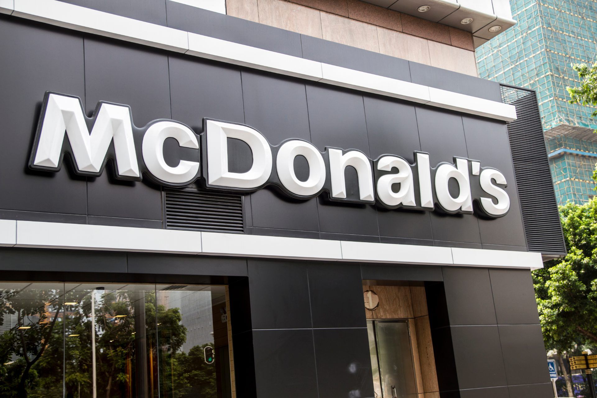 McDonald's sign on storefront - McDonald's franchise owners