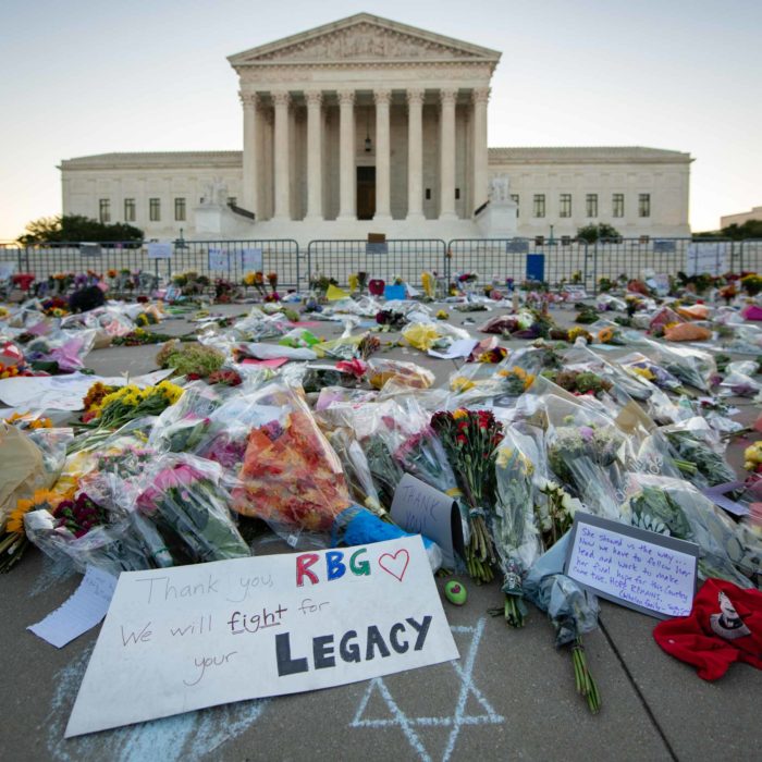 tribute flowers and notes left outside supreme court for justice Ruth Bader Ginsburg