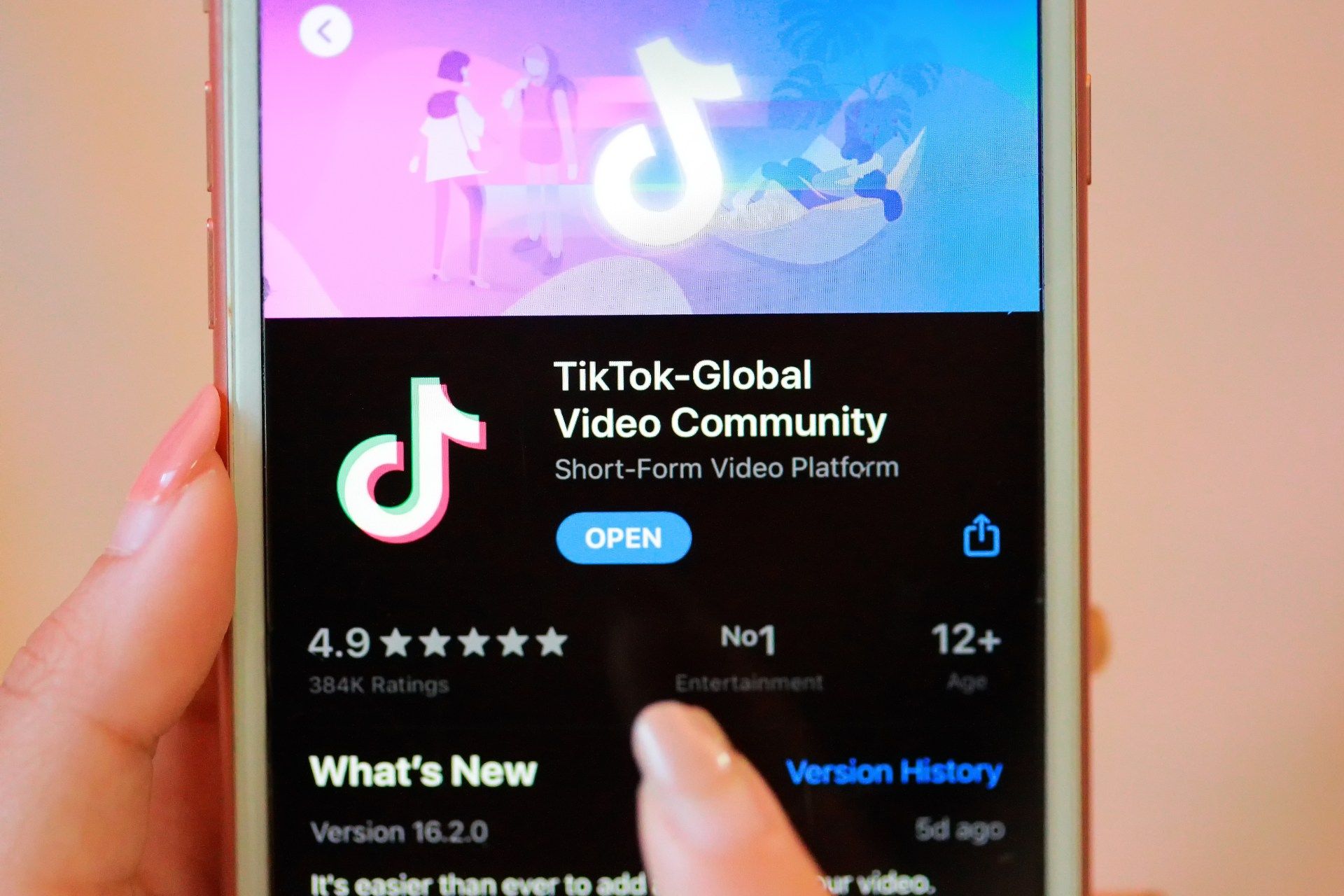 A person downloads the TikTok app from the App Store on a smartphone - TikTok users