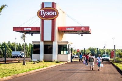 Employees walk near entrance to a Tyson plant - poultry
