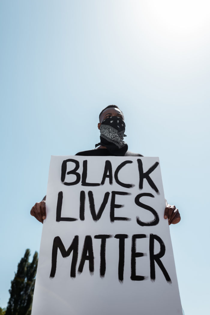Man holding Black Lives Matter sign