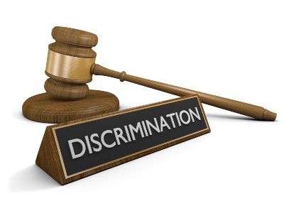A graphic of a gavel next to a nameplat that reads "discrimination" - racial discrimination