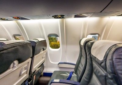 Empty blue seats on a plane - refund policy
