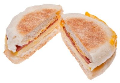 English muffin breakfast sandwich cut in half - whole-grain foods