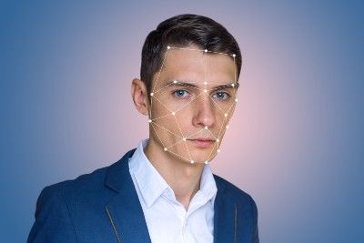 A man has his face mapped by facial recognition software