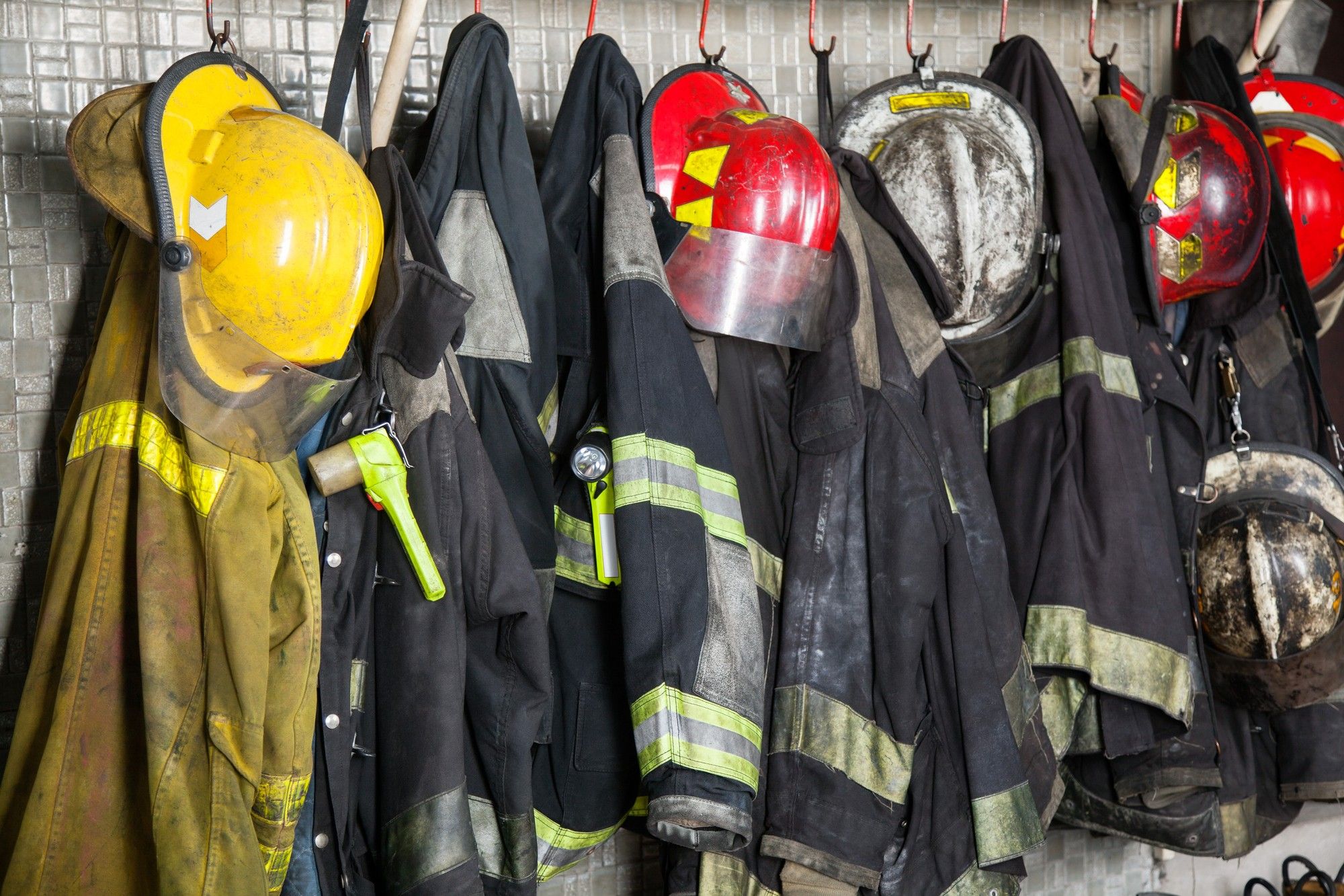 Firefighters' gear hangs on hooks - 9/11 Victims Compensation Fund