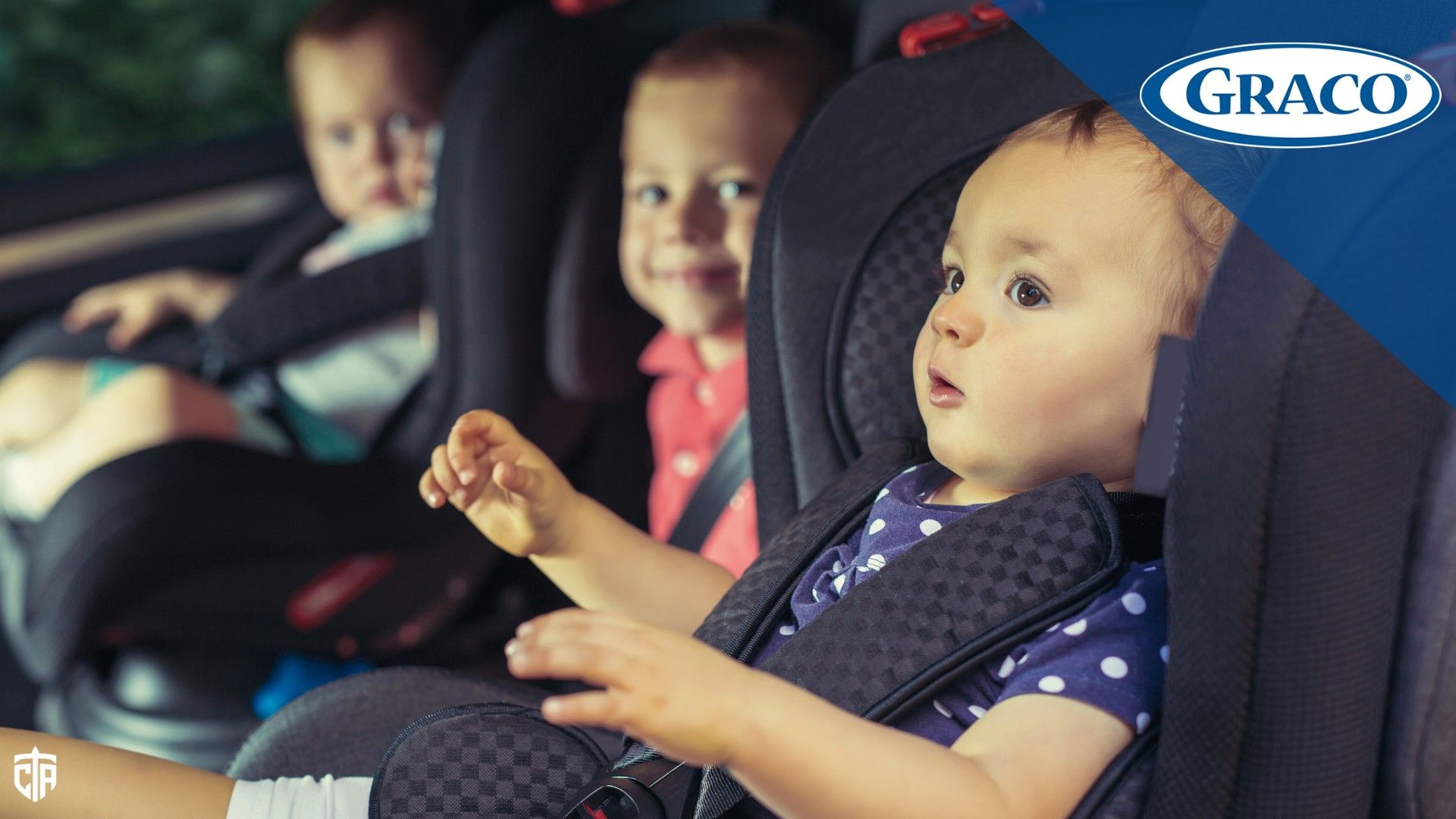 Children sit in car seats in the back of a vehicle - Graco car seats