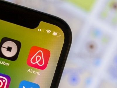 Airbnb app icon on smartphone screen - airbnb host
