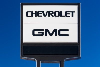 A Chevrolet GMC sign outside a dealership - GM oil
