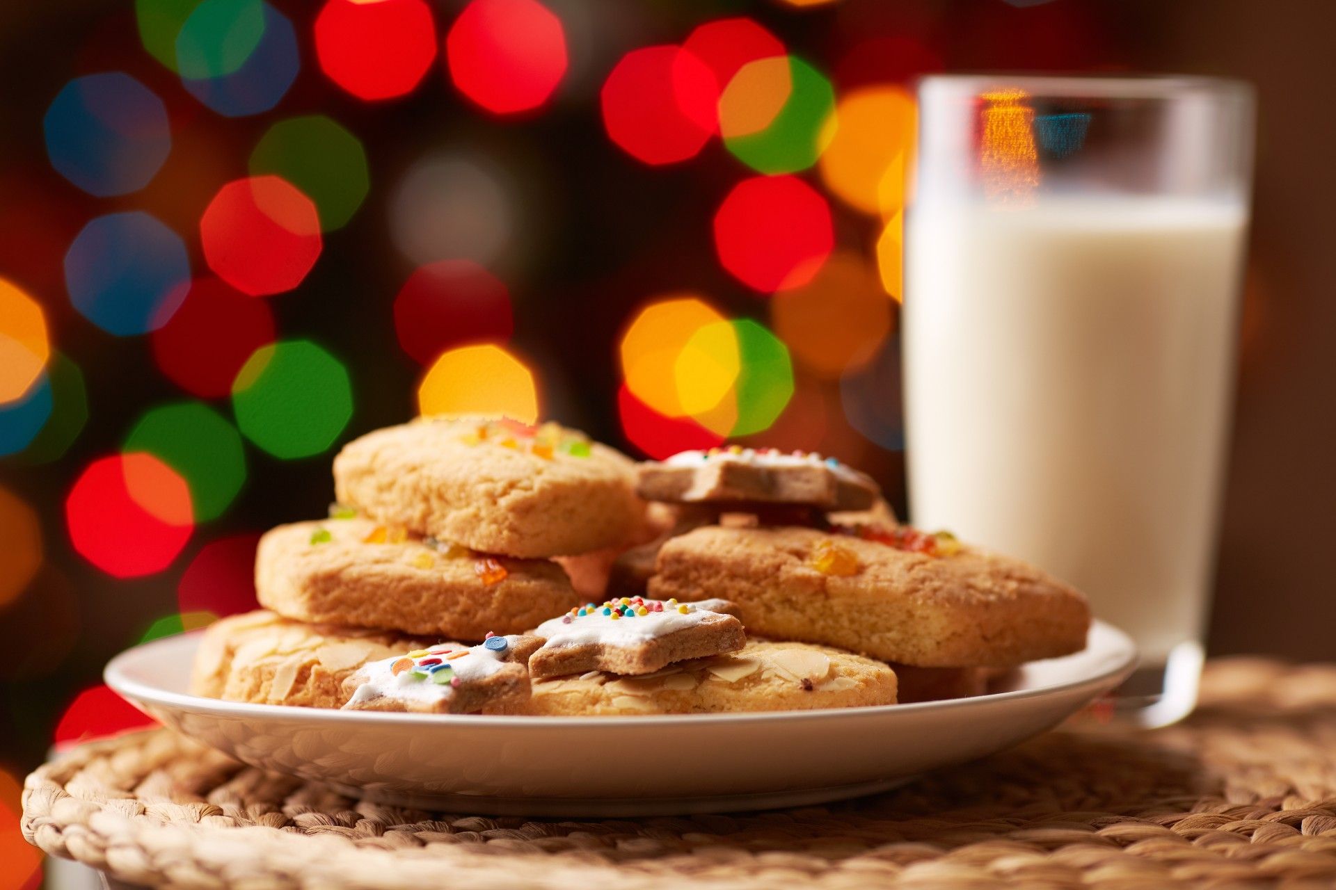 Holiday cookies on a plate next to a glass of milk - Publix holiday cookies