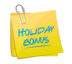 Holiday bonus written on Post it note 