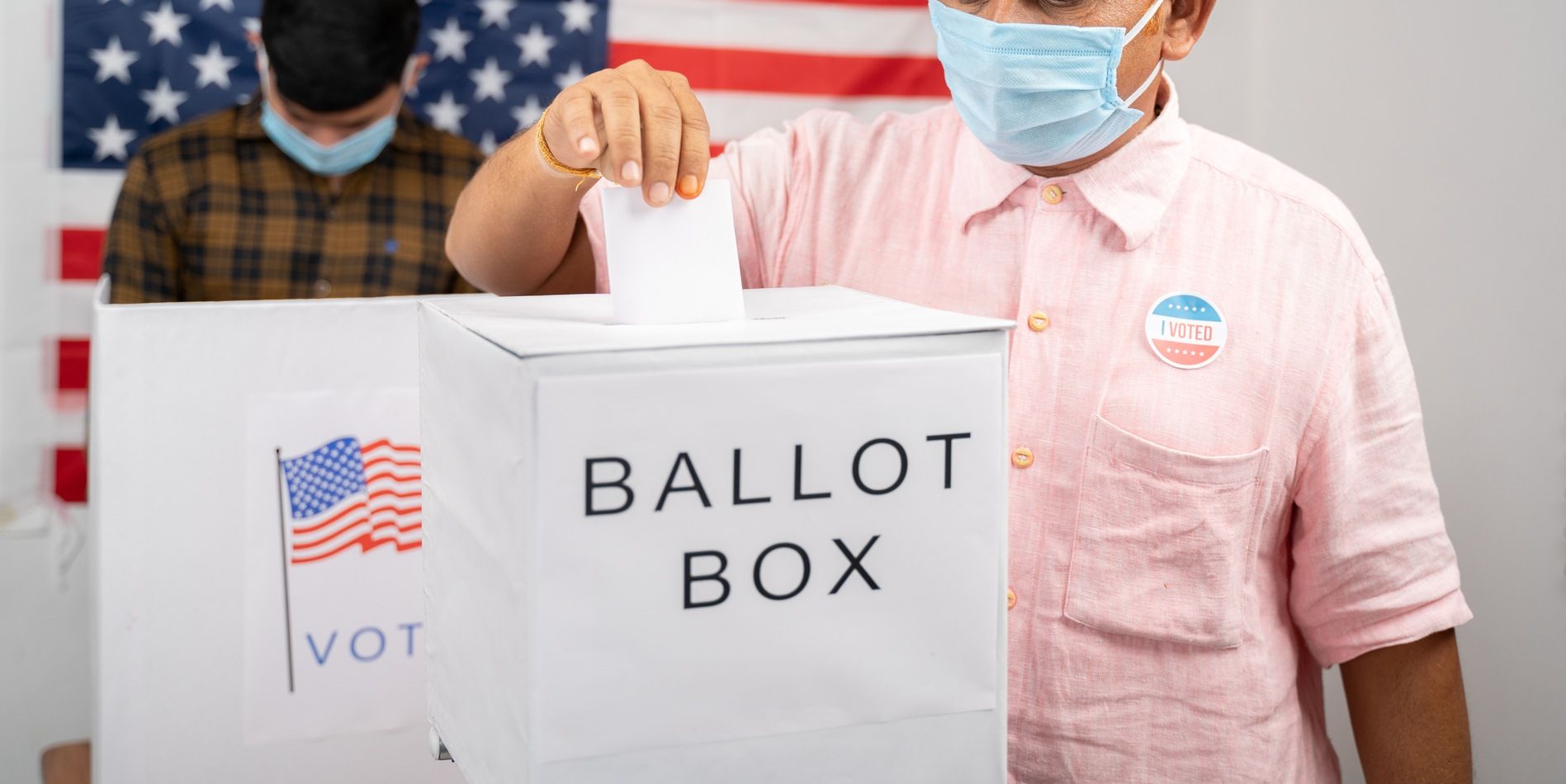 Man droppign ballot regarding voters passing measure 110 in Oregon 