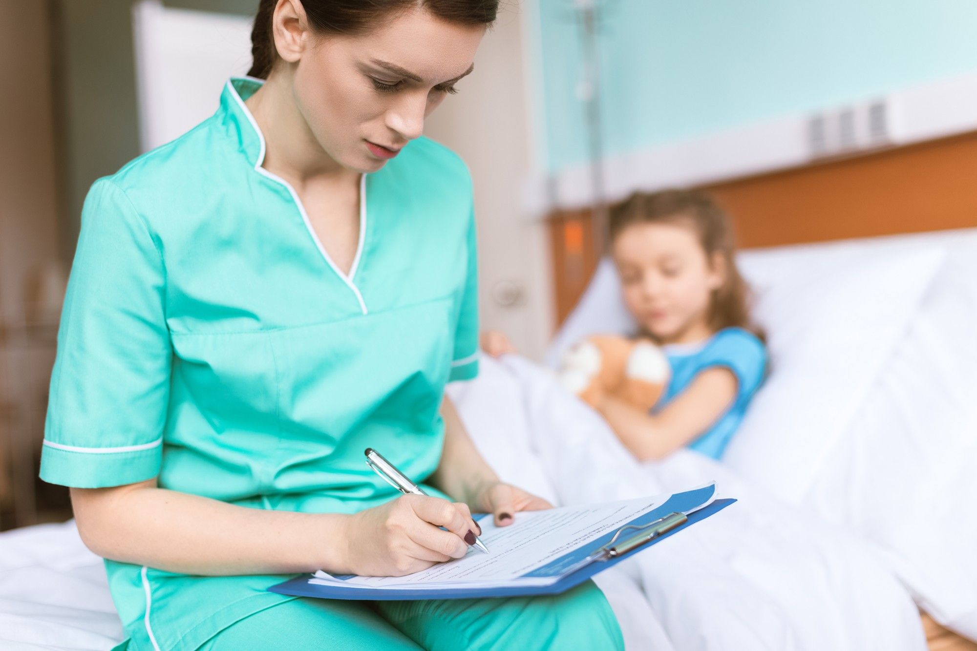 Travel nurse working with pediatric patient