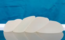 Breast implants lined up in operating room
