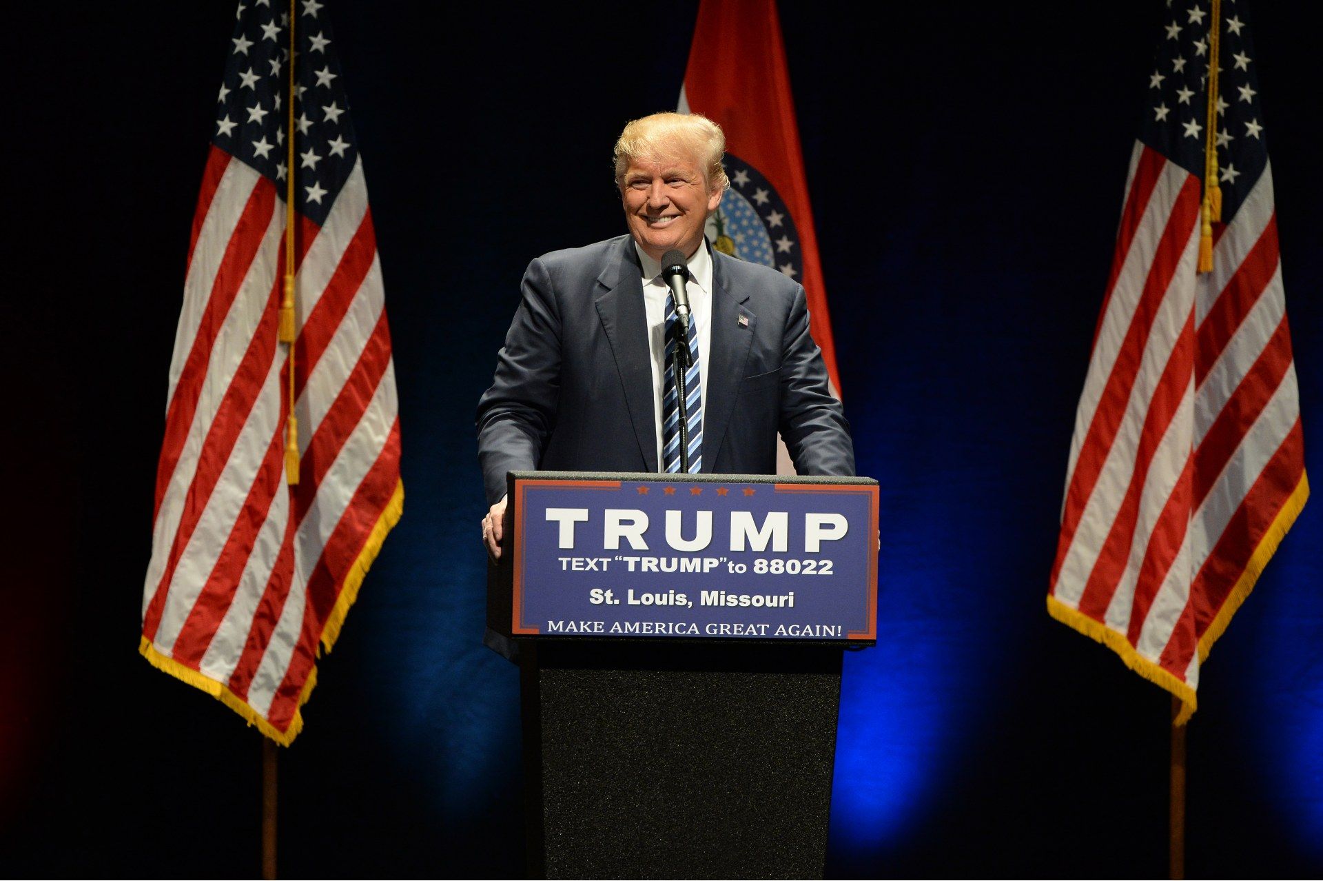 Donald Trump speaks at a podium in front of U.S. and Missouri state flags - election results