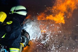 Firefighters use foam to extinguish a fire - forever chemicals