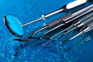 Dental tools on a sparkly blue surface - Nova Southeastern University - dental tool sterilization
