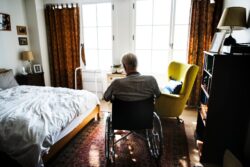 elderly man left alone in wheelchair