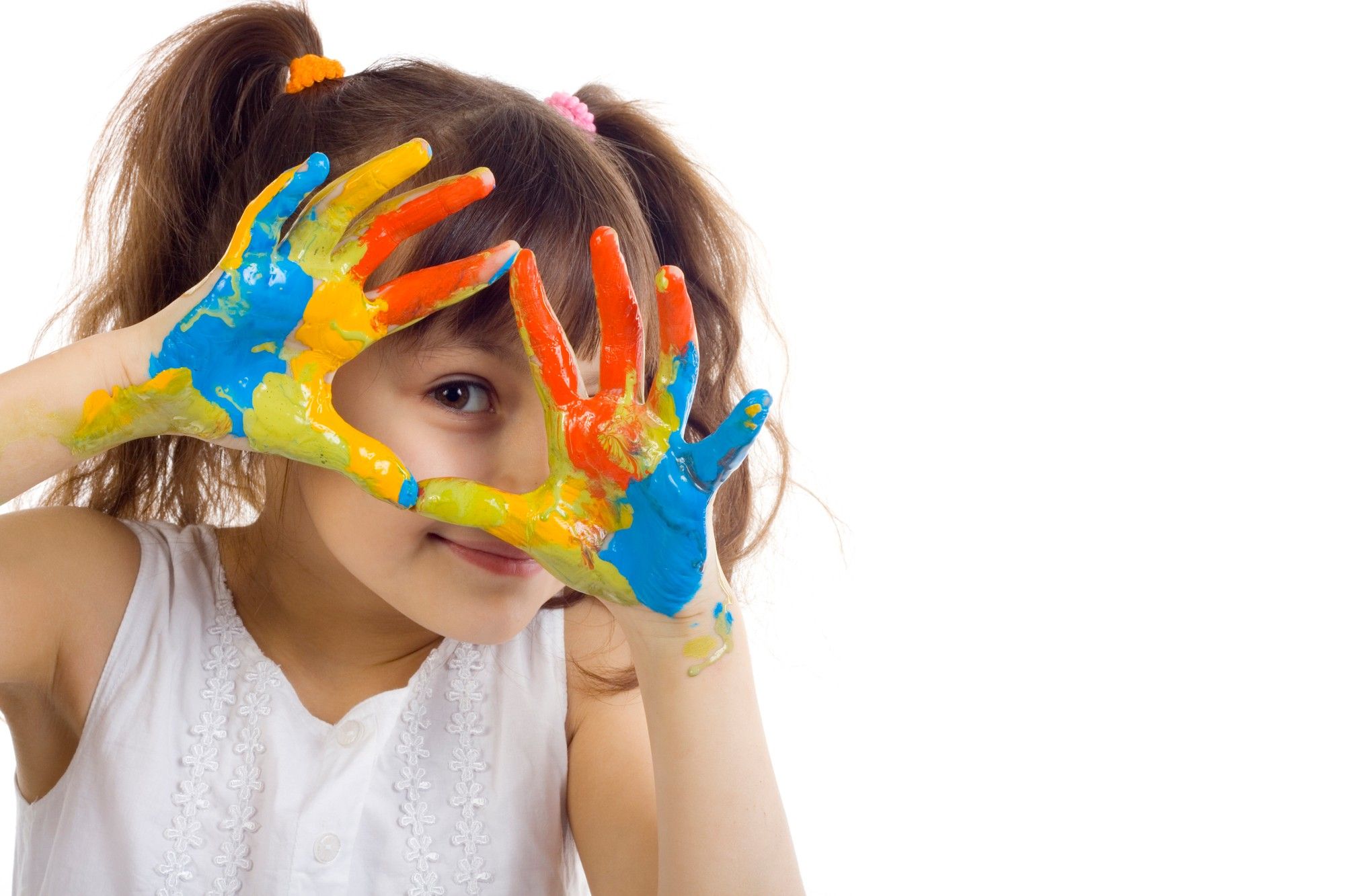 young girl with hands covered in finger paint
