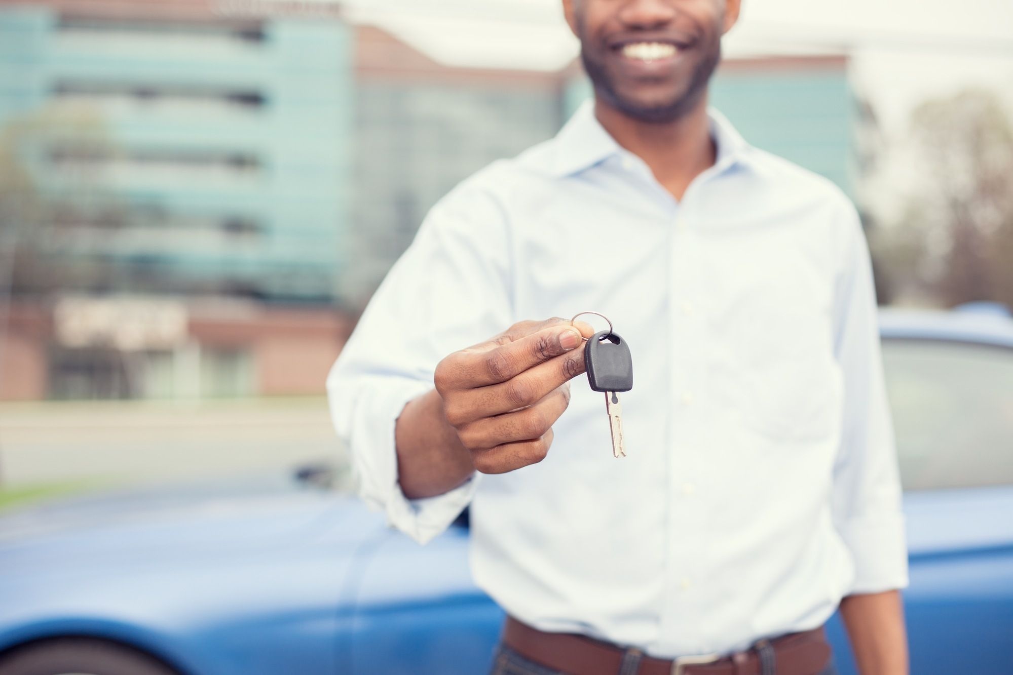 young man with new car keys