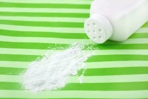 Spilled talcum powder on a striped green surface - baby powder