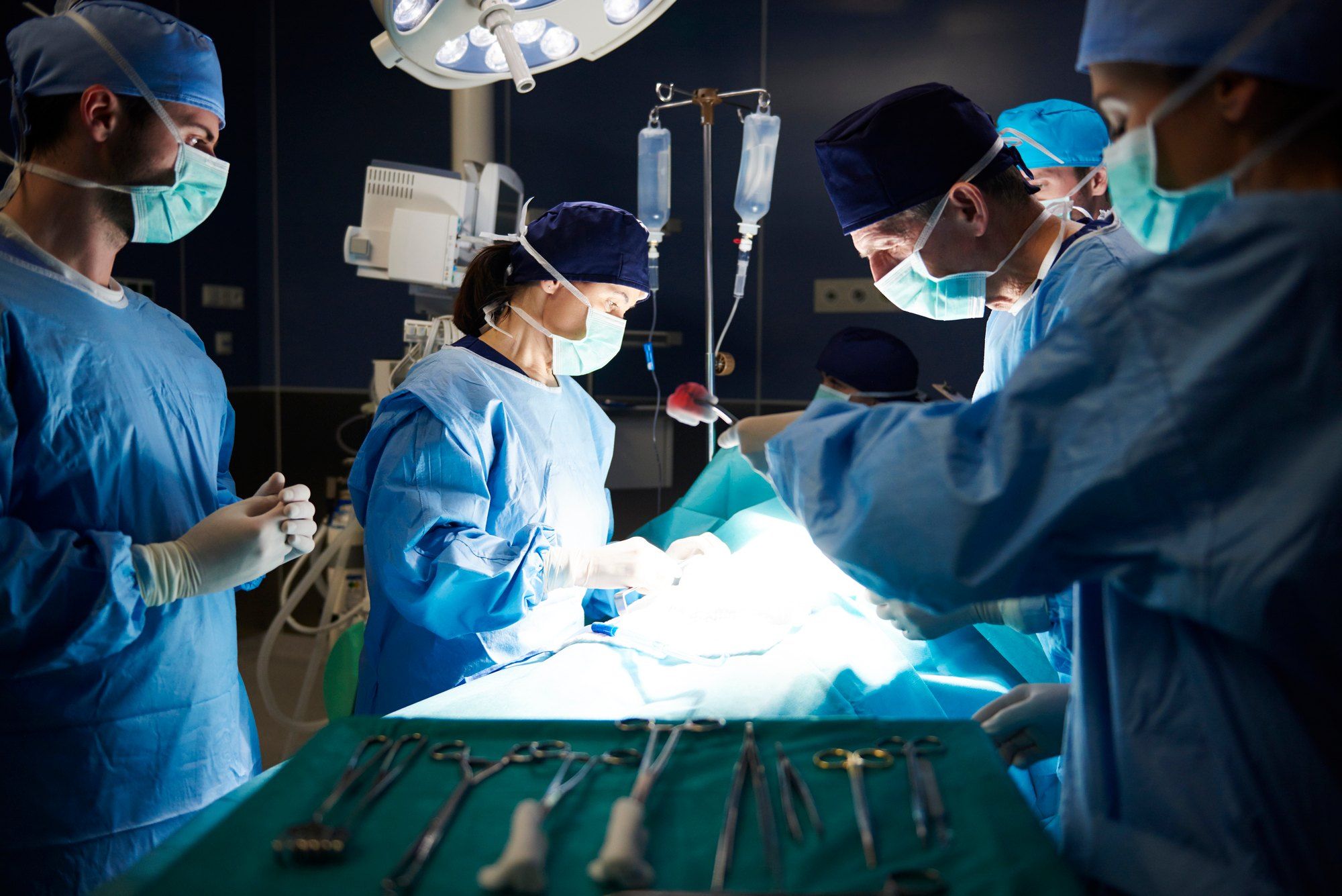 surgeons operating on patient