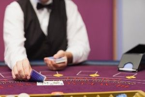 A casino dealer deals blackjack - Wynn Resorts