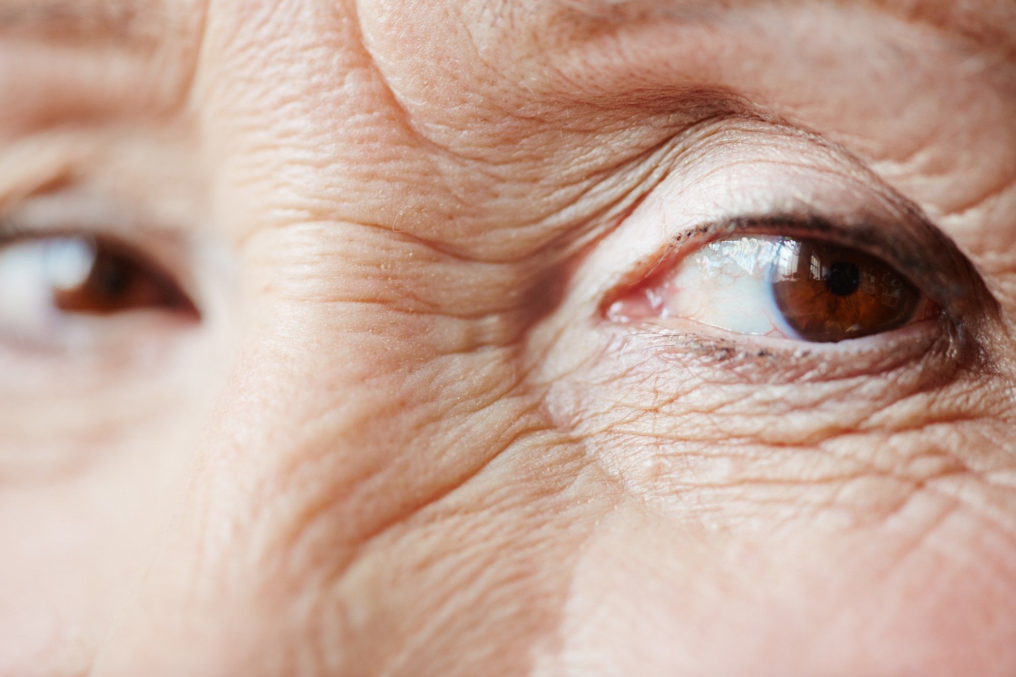 elderly woman's eyes close up of glance