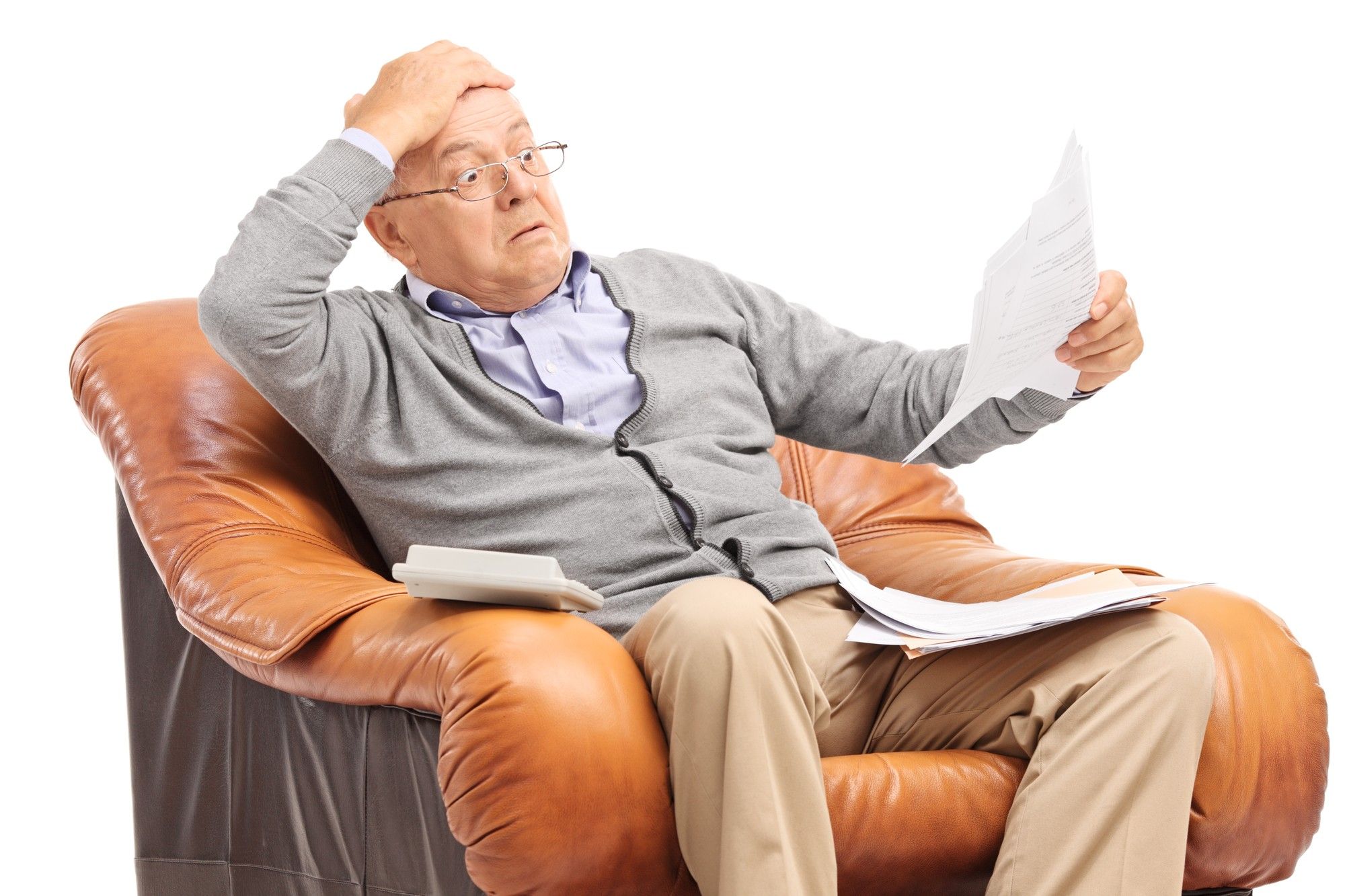 shocked elderly man looking at unexpected bill